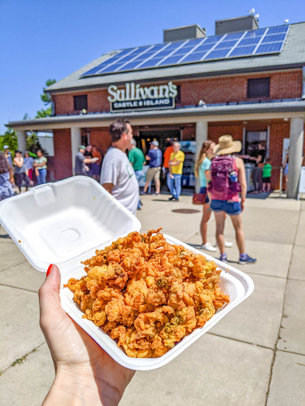 container of fried clams in front of Sullivans on Castle Island - Boston bucket list