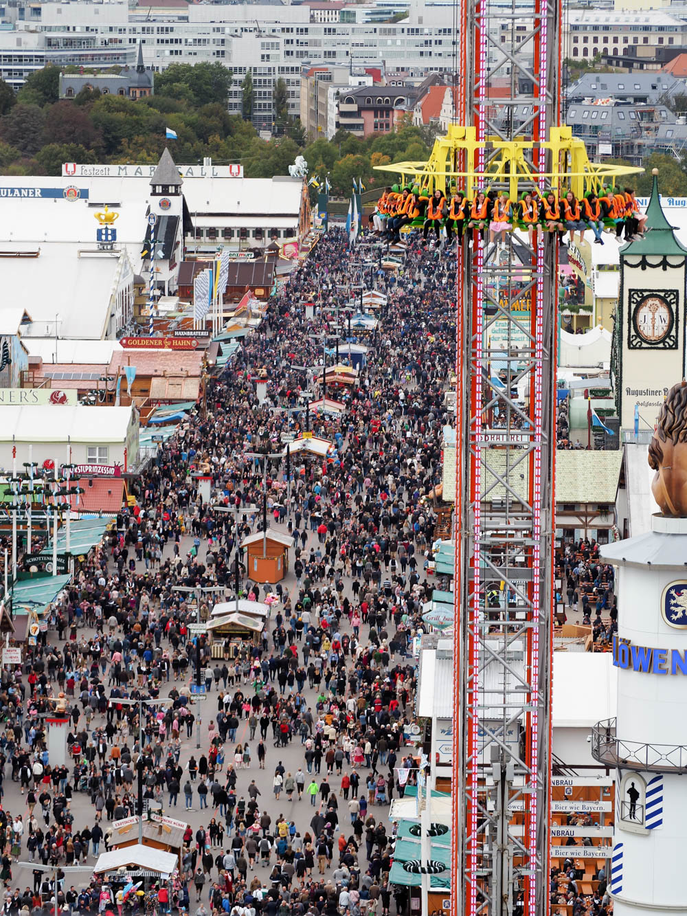 shot of large oktoberfest crowds from up high in the ferris wheel