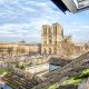 view of Notre Dame cathedral in paris from a rooftop window