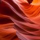 purple, orange, and red swirls of color in a slot canyon