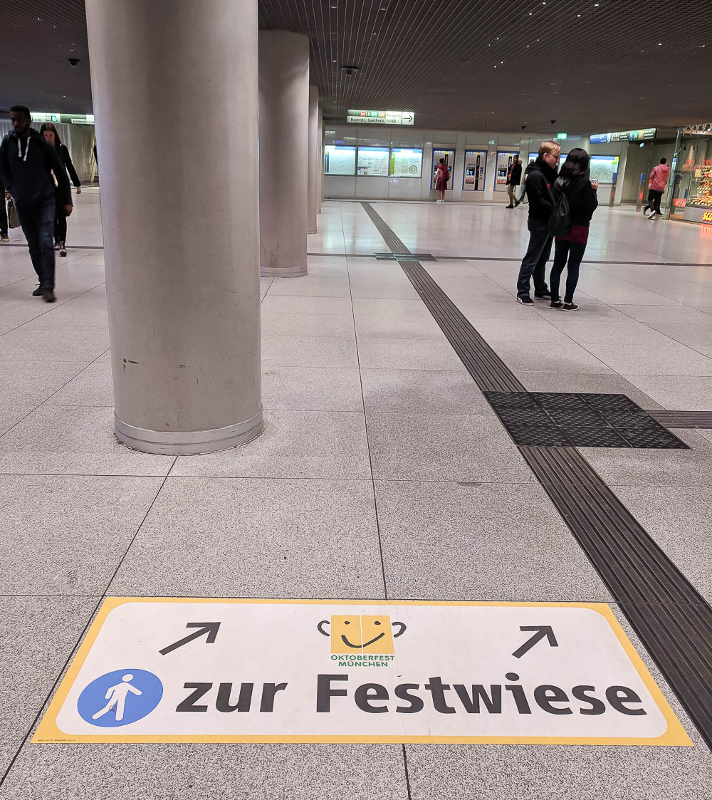 sign in munich train station pointing the way to oktoberfest