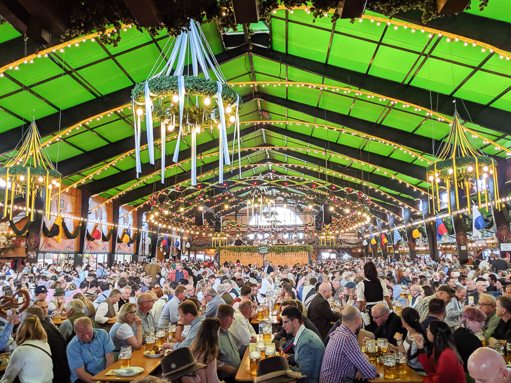 inside the augustiner beer tent with green and black banners