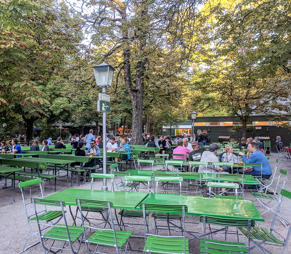 people hanging out in a beer garden during the day