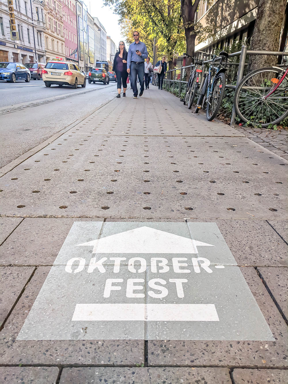 oktoberfest sign on the ground pointing the way