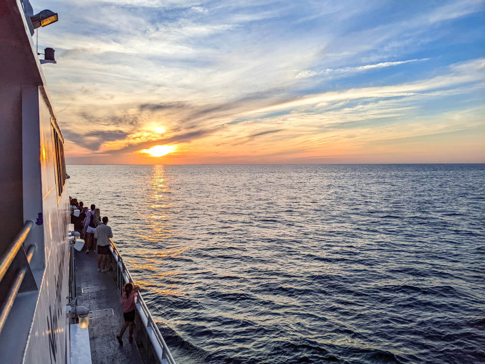 sunset over the ocean seen from a yacht