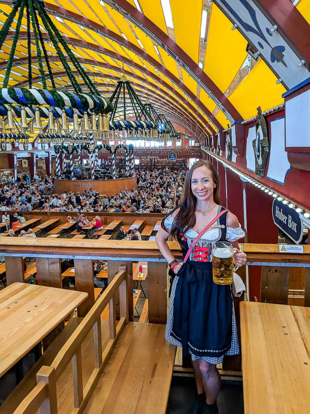 me in a black and red dirndl inside a beer tent at oktoberfest in munich
