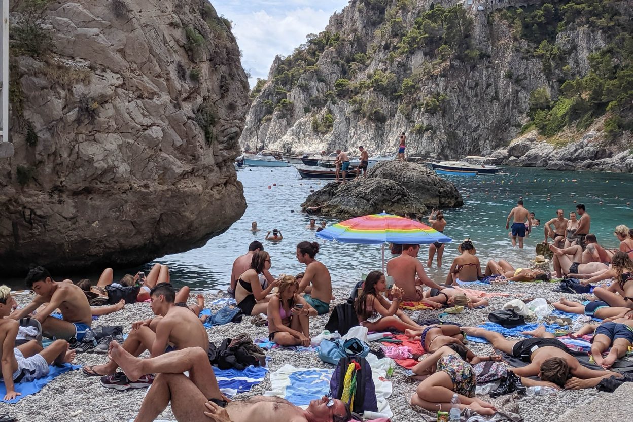 tiny beach packed with people