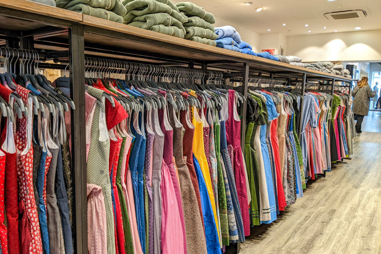 Racks of colorful dirndls at a shop in Munich