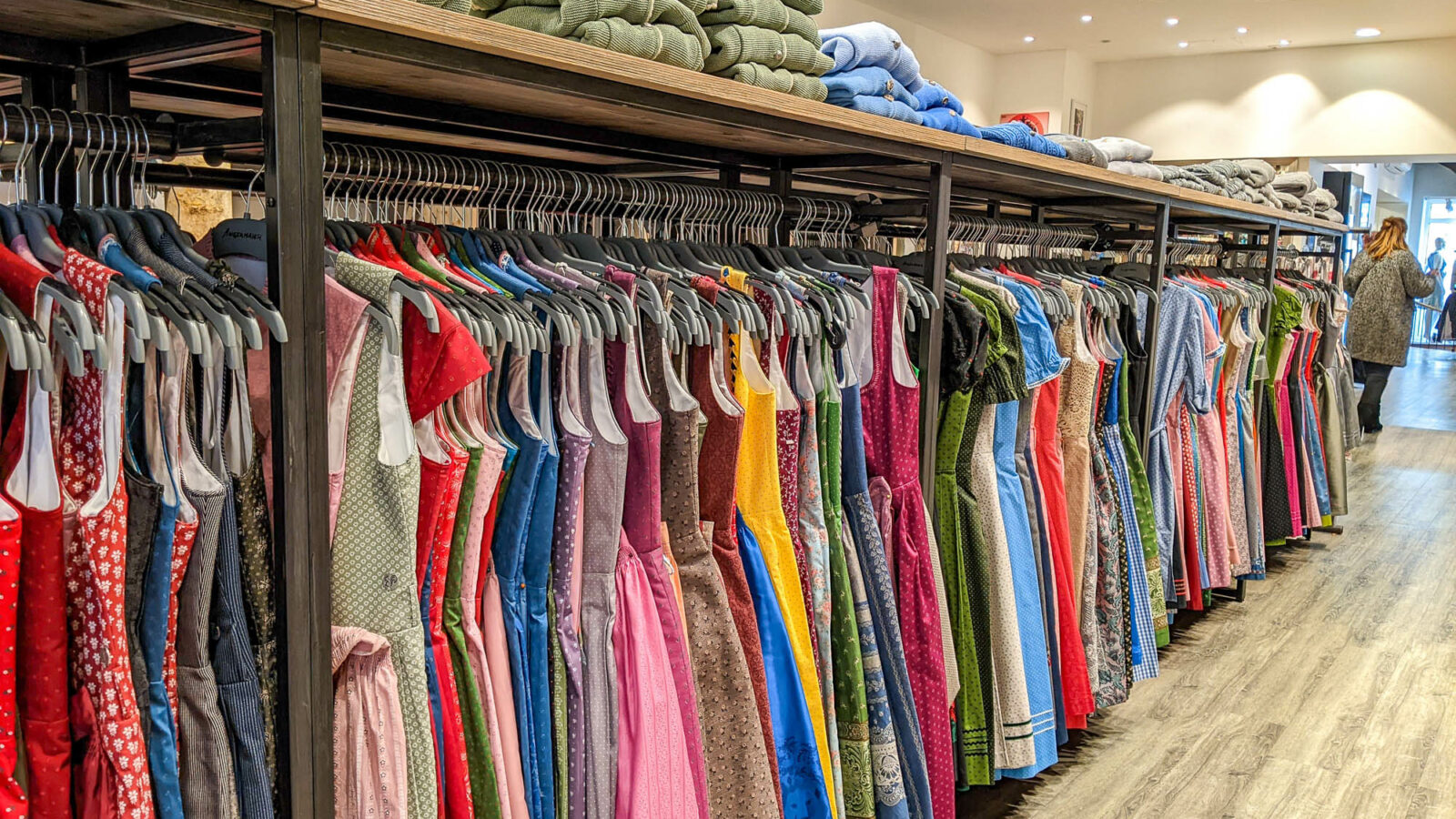 Racks of colorful dirndls at a shop in Munich