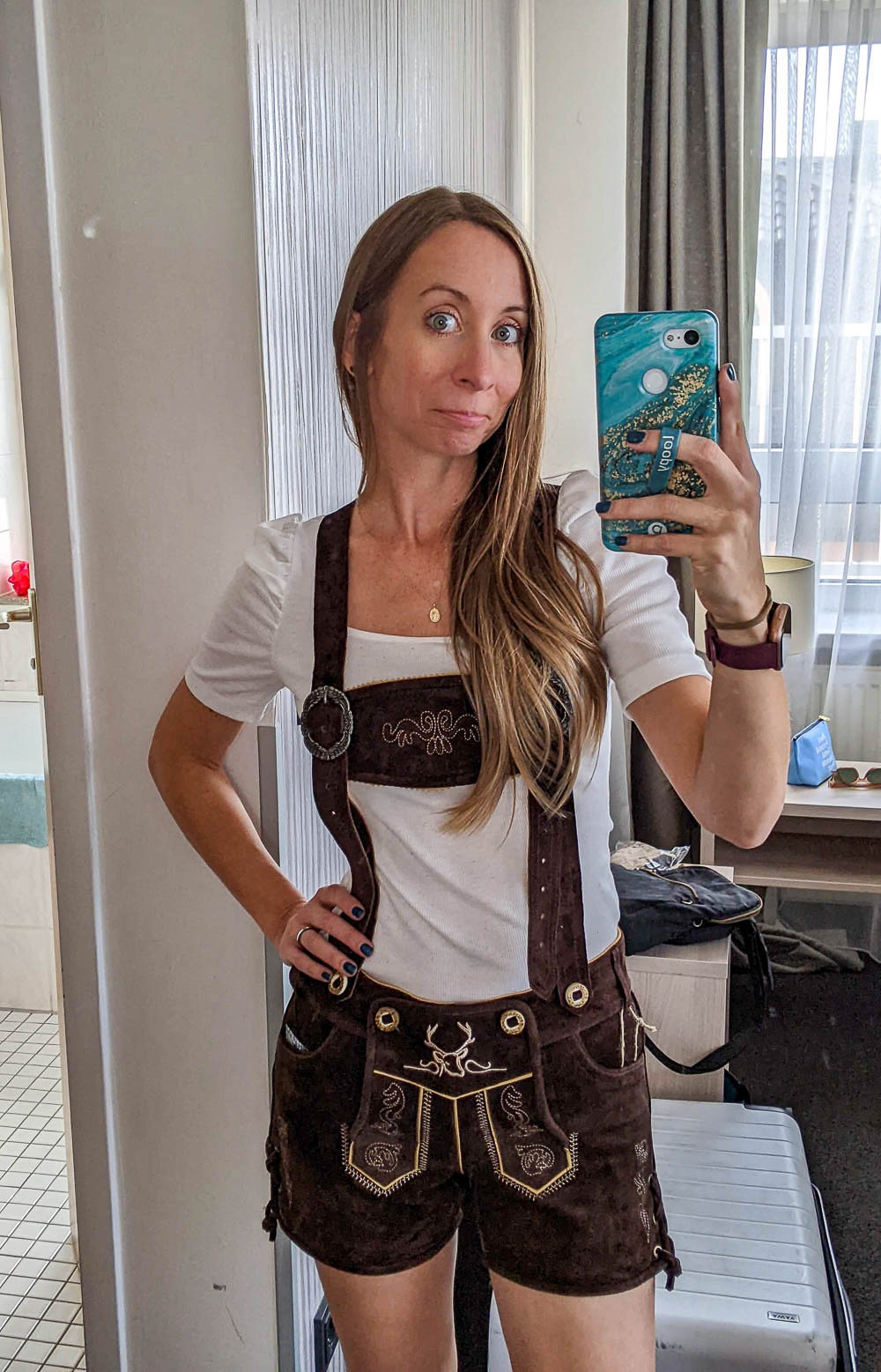 me in a white shirt and brown female lederhosen