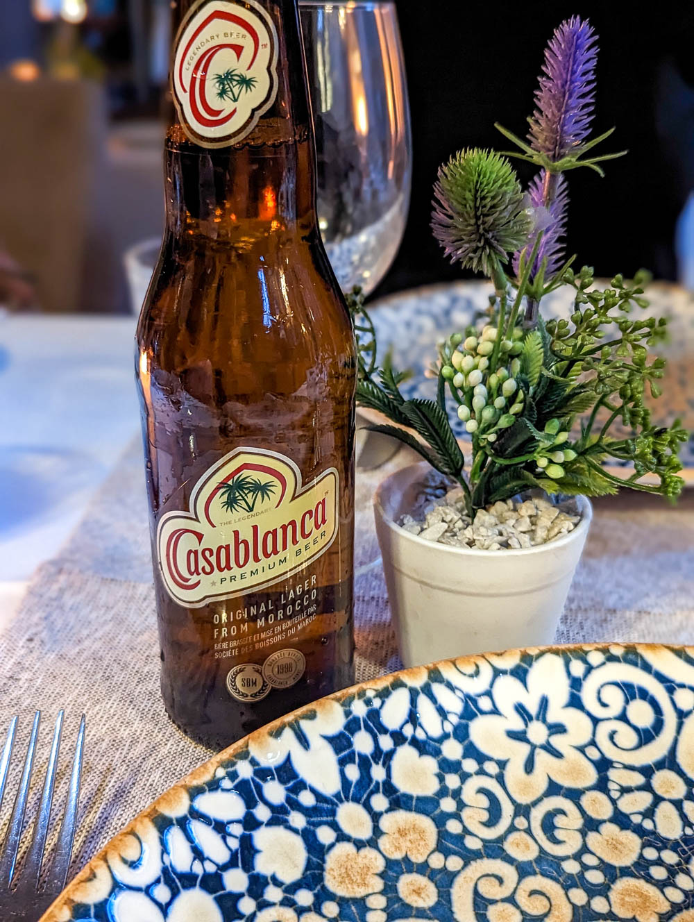 bottle of Casablanca beer on a table inside a restaurant
