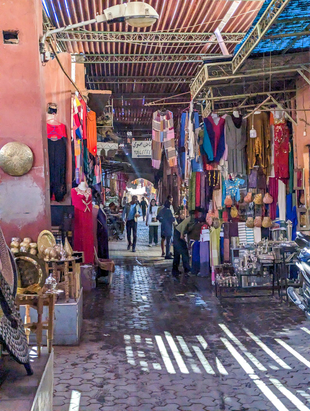 open air shopping area filled with clothing