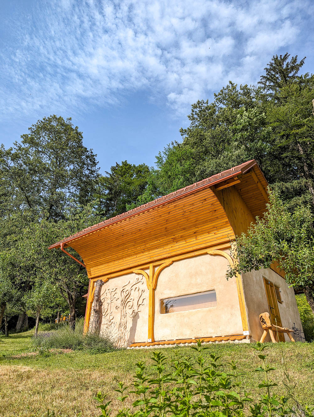 outside of a bee house under a blue sky