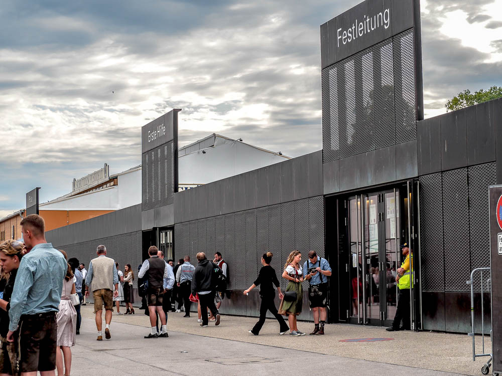 people standing outside the lost and found office at oktoberfest