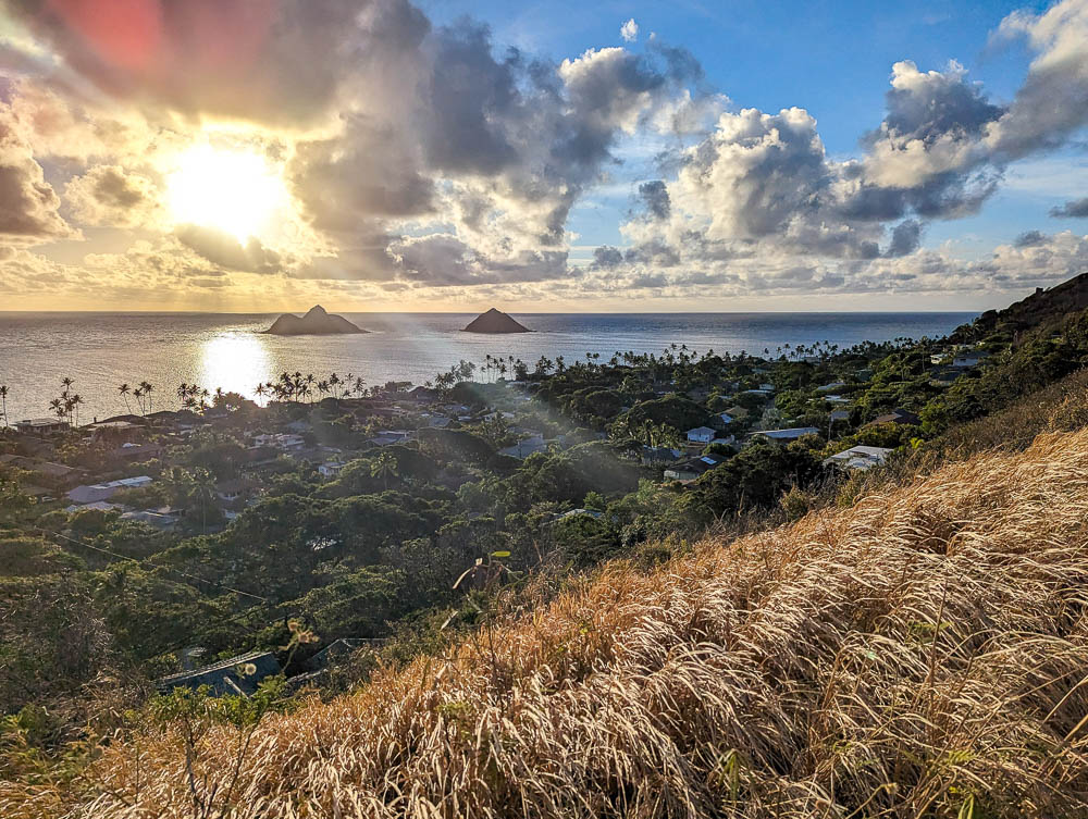 sunrise over the ocean and two small islands