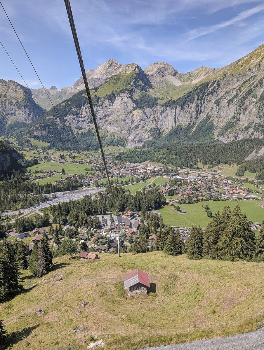 looking down from a mountain cable car