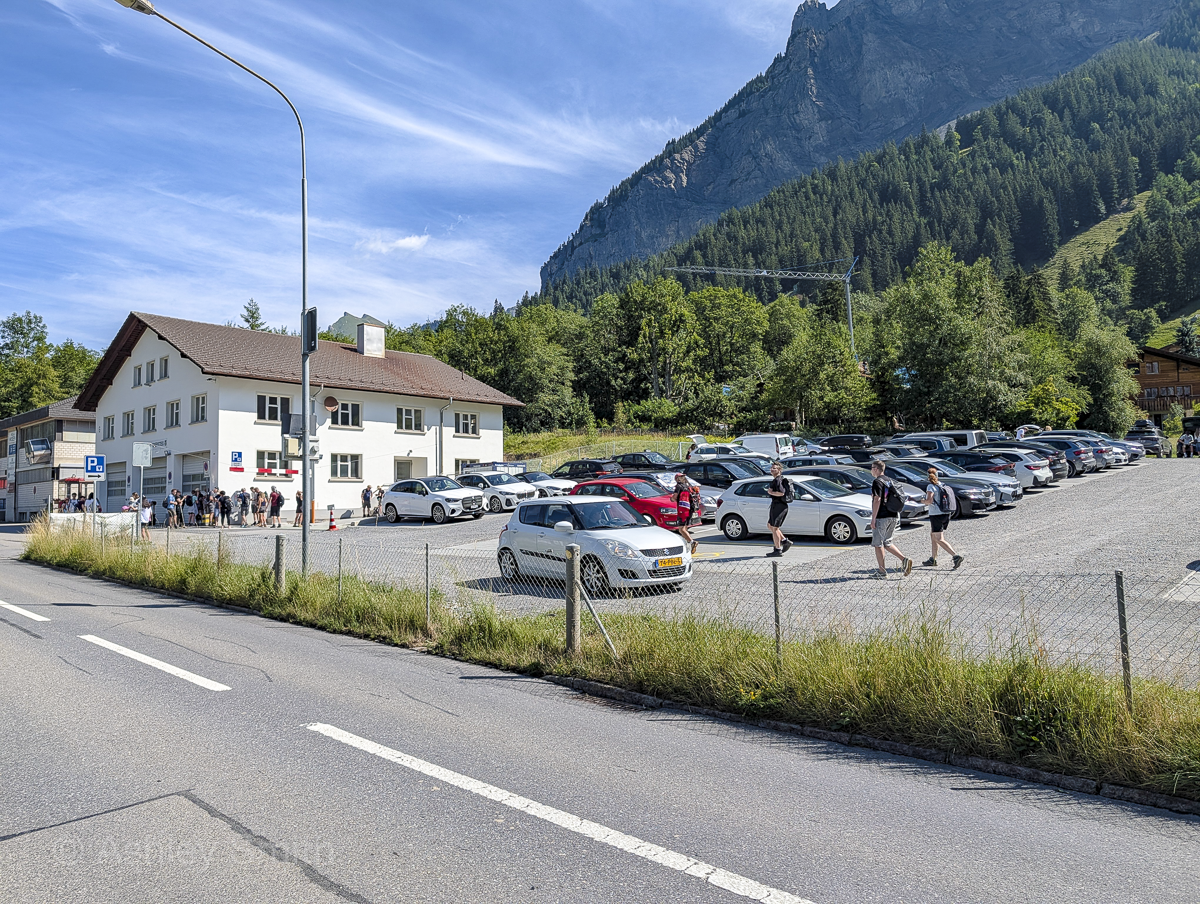 parking lot next to some mountains