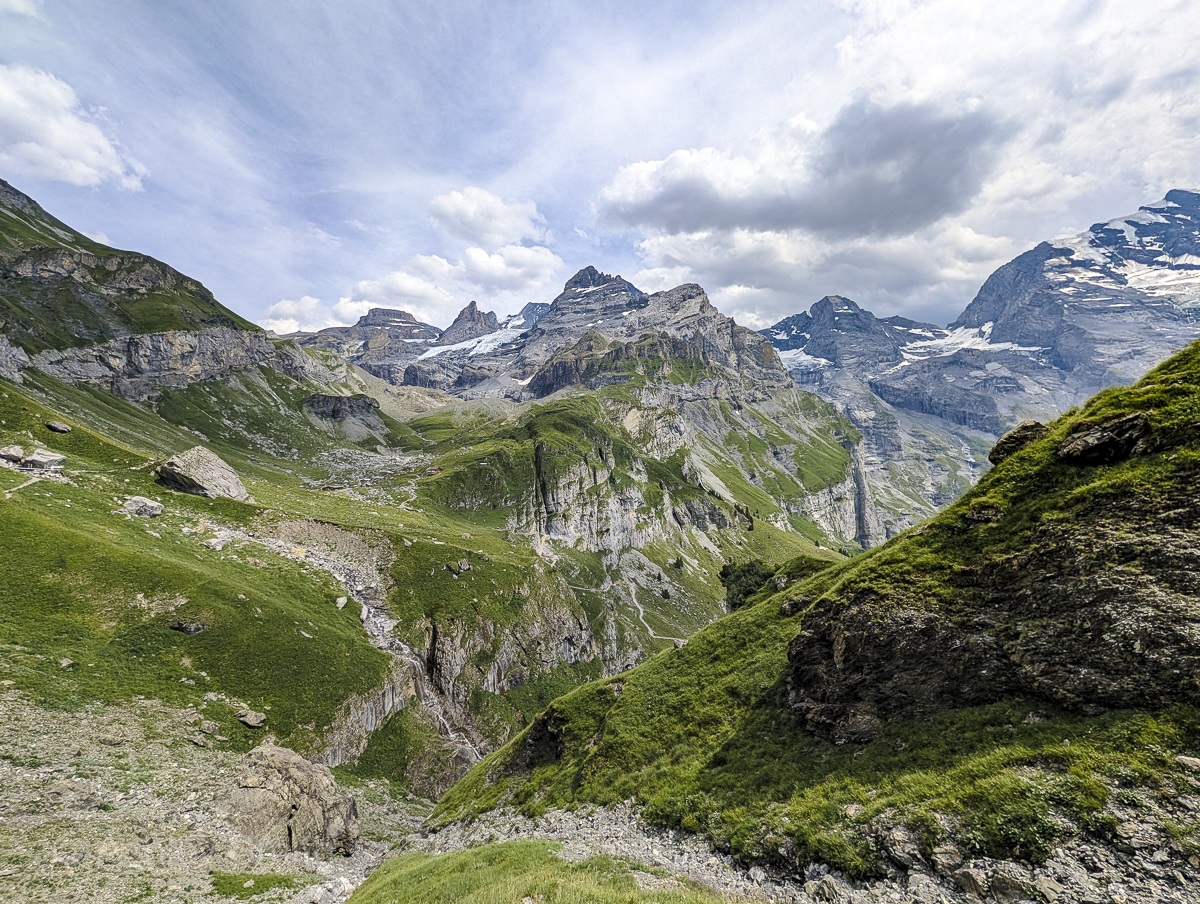 rocky mountainous area with green fields